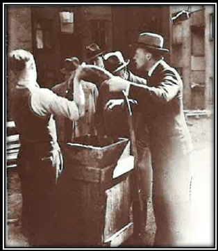 A group of men standing around a wooden box

AI-generated content may be incorrect.